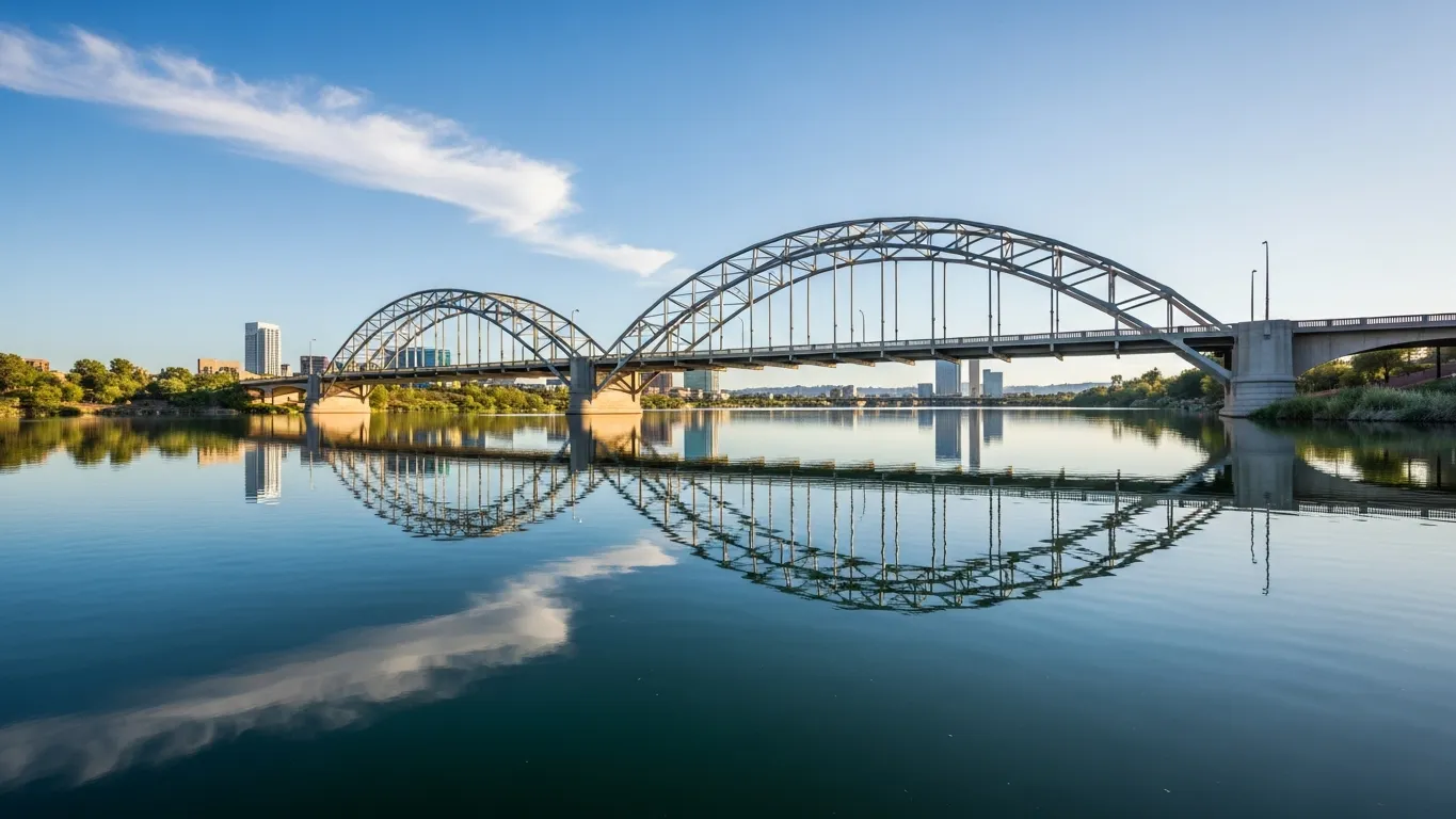 Tempe Town Lake with Mill Avenue Bridge and calm reflections
